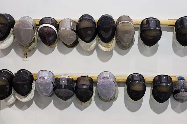 Fencing masks on the wall